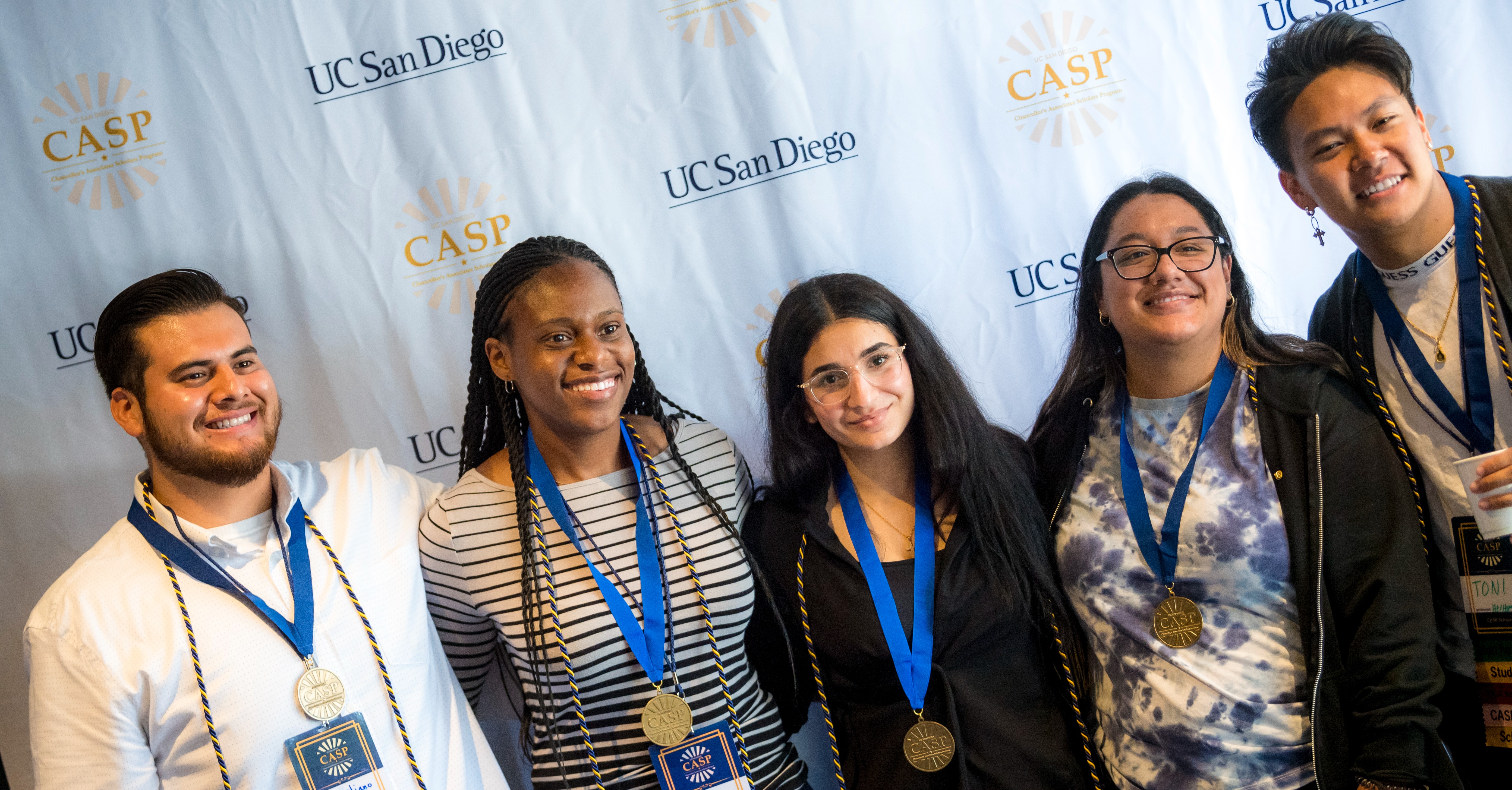 Group of five Chancellor's Associates scholars with medals
